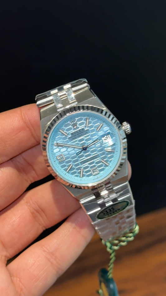 Land Dweller | 36mm | Clean Grade | Silver Chain |  Sky Blue Textured Dial
